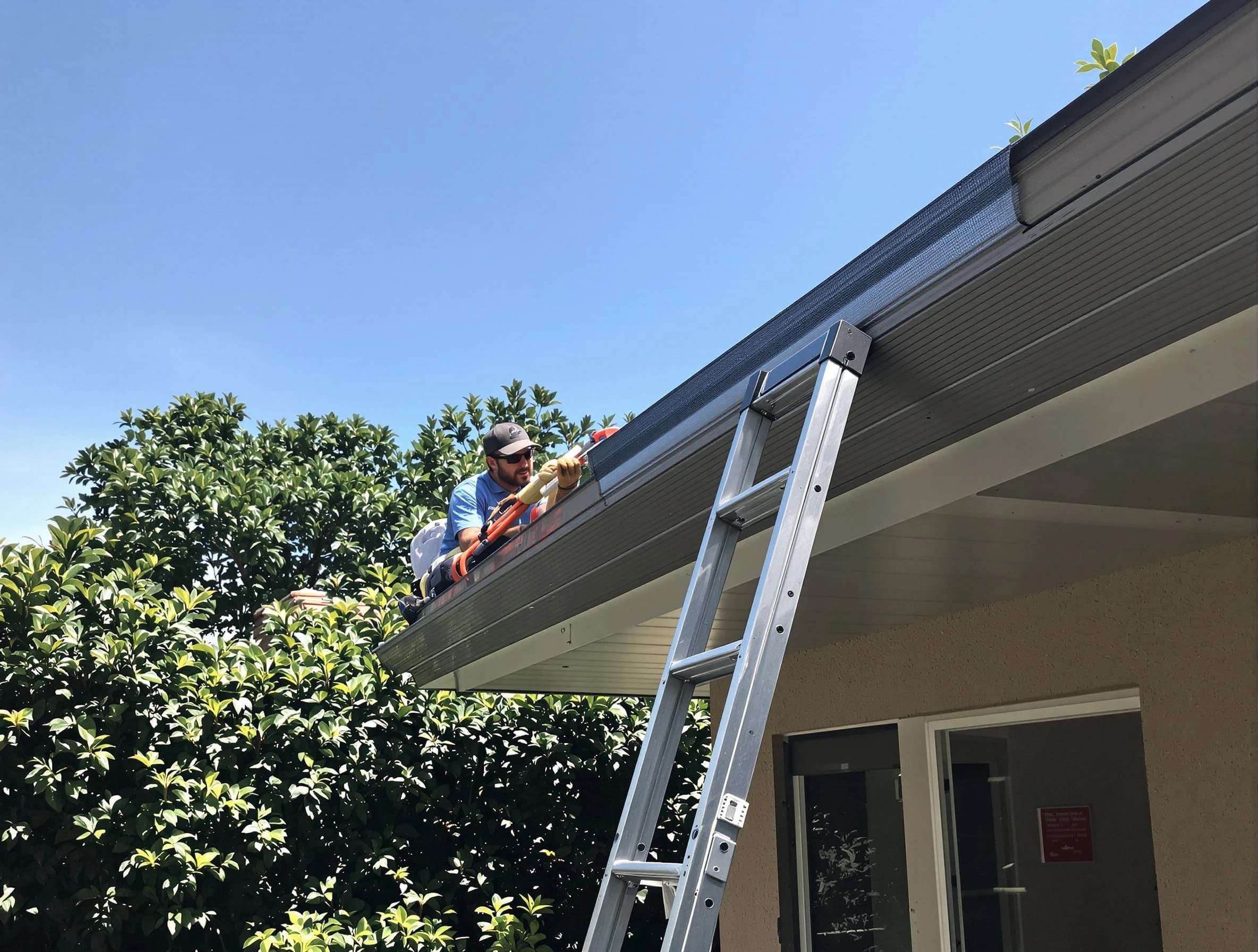 Barberton Roofing Company installing gutter guards for a homeowner in Barberton, OH